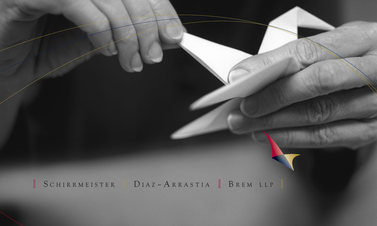 The Schirrmeister Diaz-Arrastia Brem Hands Banner featuring hands folding a paper crane.