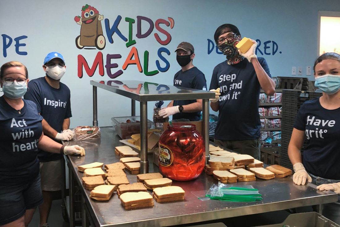 The BrandExtract team makes sandwiches at Kids' Meals Inc. for impoverished children.