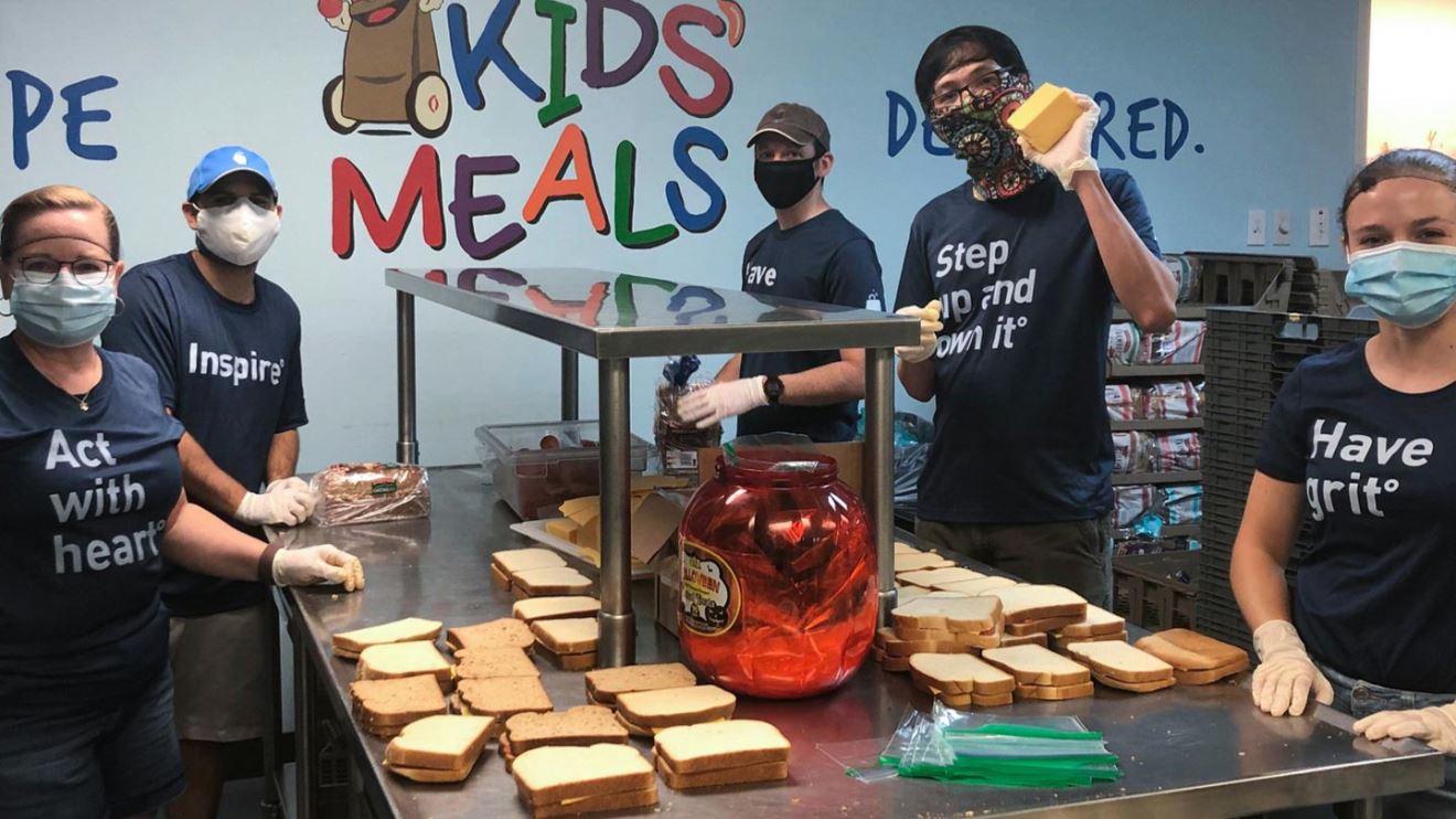 The BrandExtract team makes sandwiches at Kids' Meals Inc. for impoverished children.