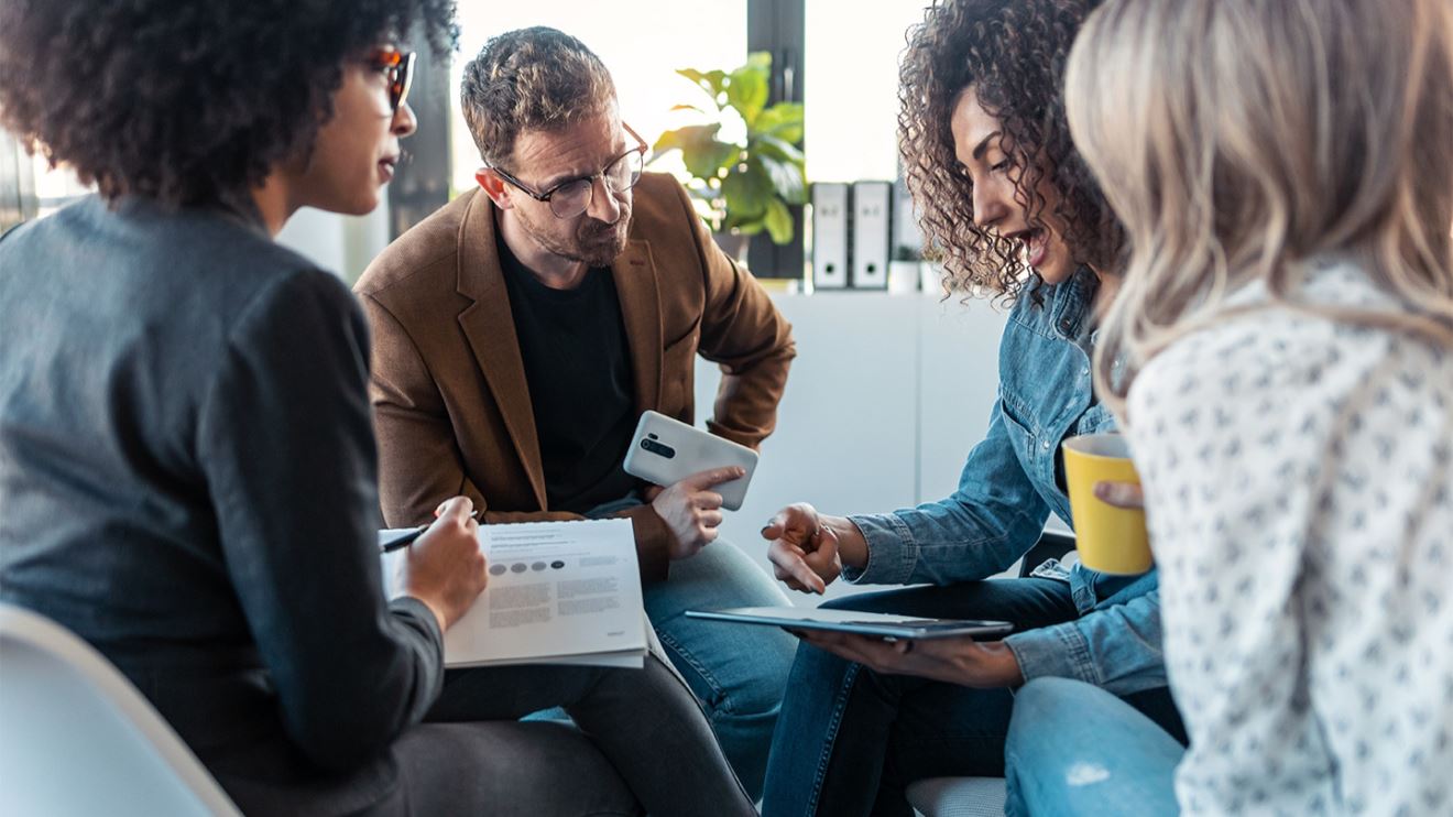 Group of people meeting and holding a discussion