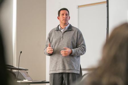 Bo speaking in front of UH students about the power of brand belief.