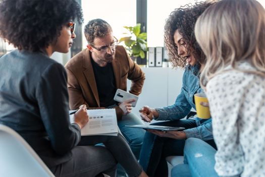 Group of people meeting and holding a discussion