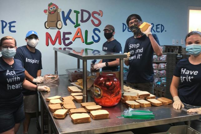 The BrandExtract team makes sandwiches at Kids' Meals Inc. for impoverished children.