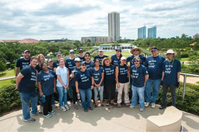 A group shot of the BrandExtract team after cleaning McGovern Centennial Gardens.