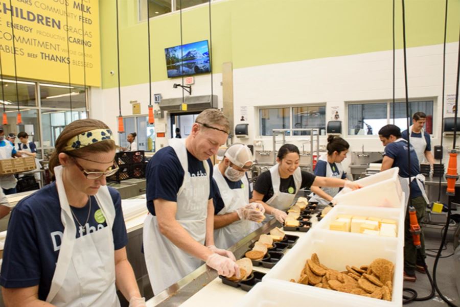 A picture of Julia packing food at the Houston Food Bank.