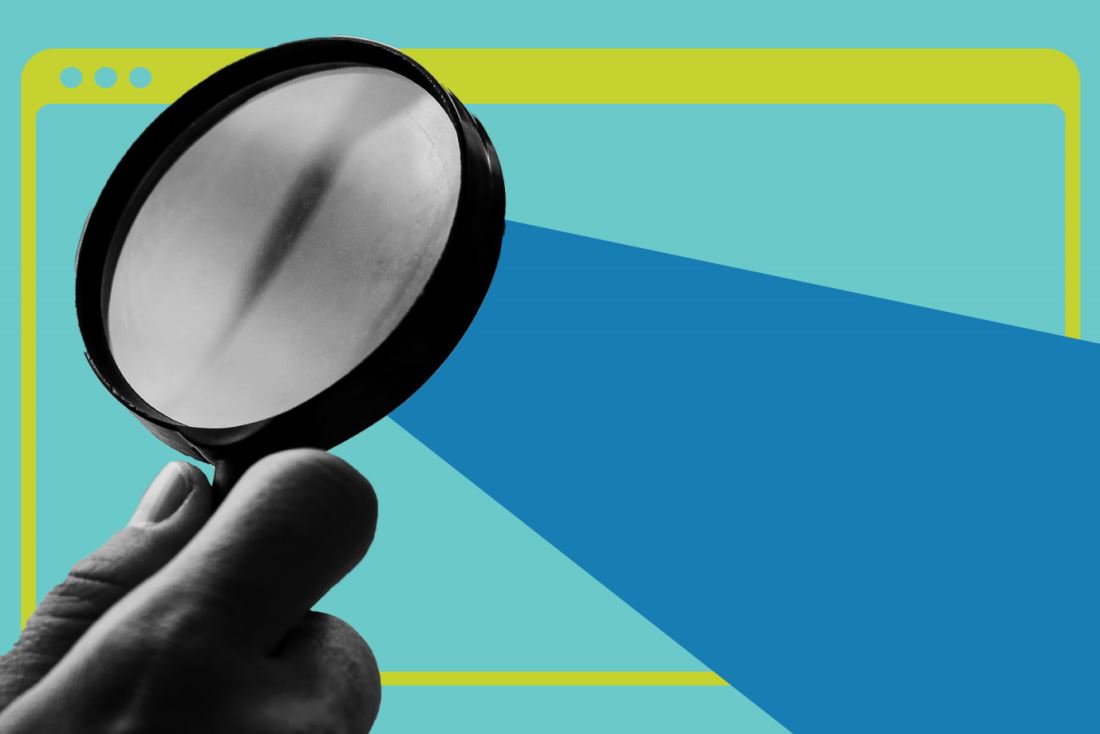 A hand holding magnifying glass over a browser window