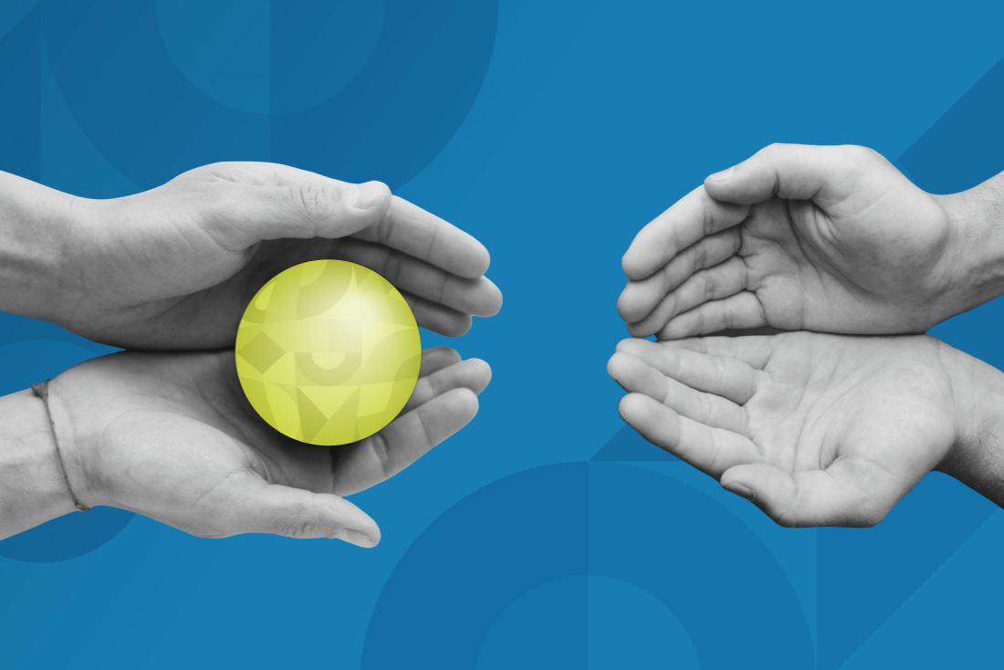 A pair of hands holding a green BrandExtract-branded sphere, passing the brand value to a new pair of hands.