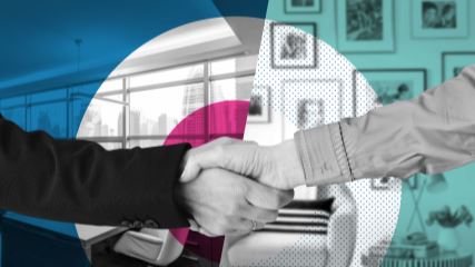 Photograph of two hands shaking over a pink, blue and teal background