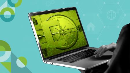 black and white hands holding a laptop with a green image of a safe on the screen. 