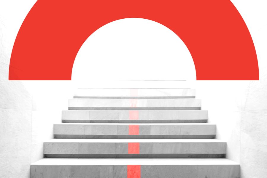 Black and white photograph of a staircase leading upwards towards a red BE arc graphic.