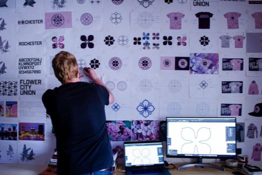 Chris Payne designing Flower City Union logo