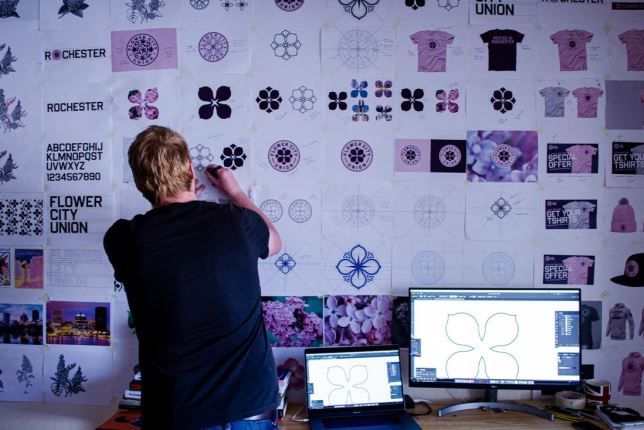 Chris Payne designing Flower City Union logo
