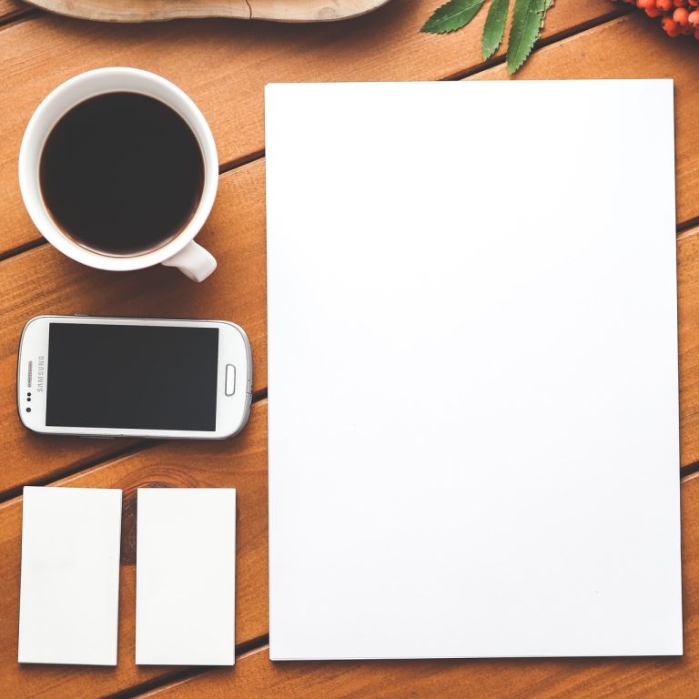 Coffee, Smartphone and Pen on a Desk