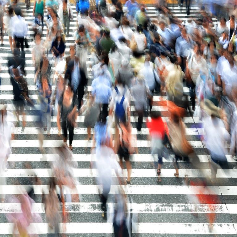 Pedestrians chaotically crossing the street