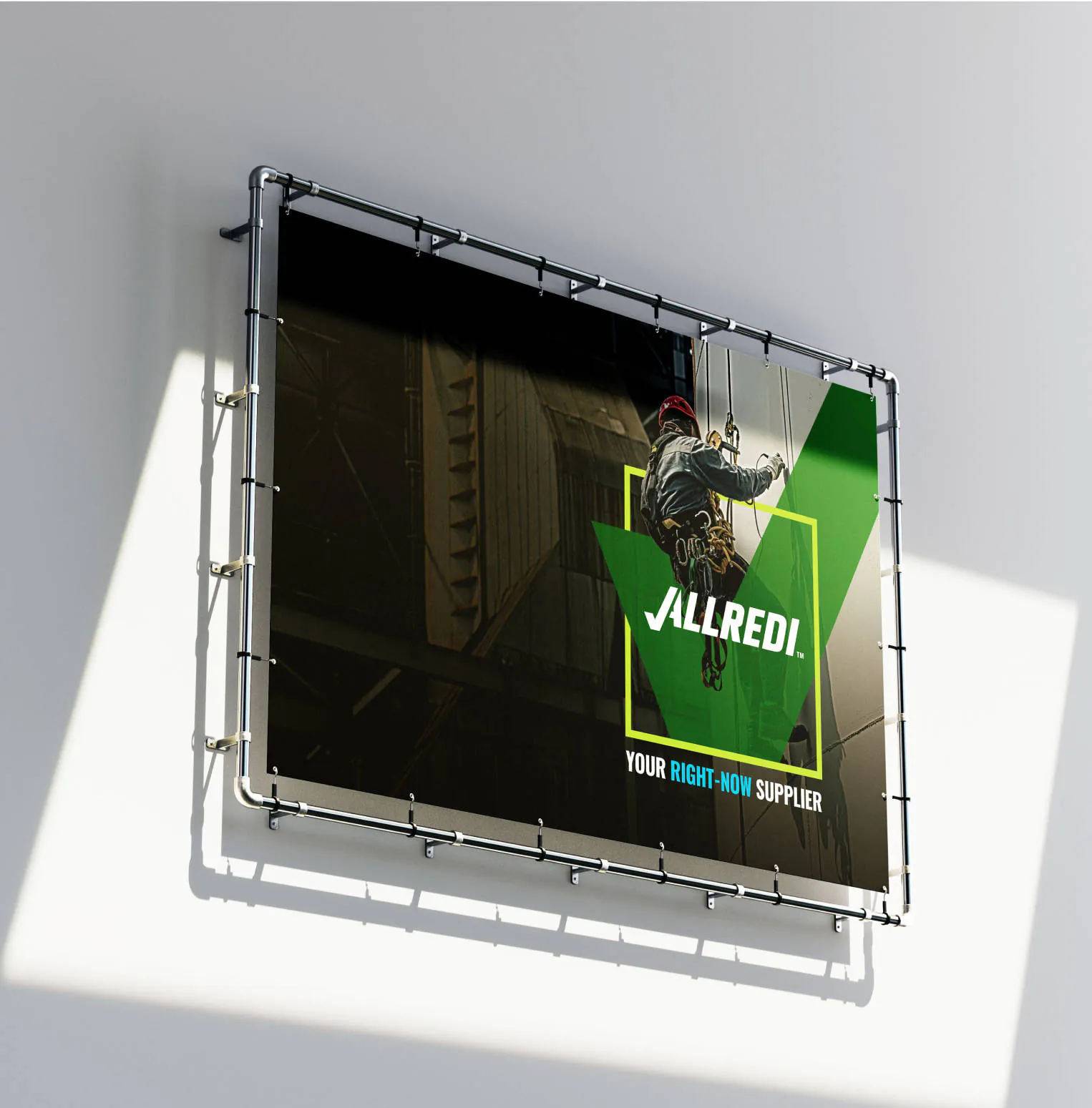 An mounted Allredi billboard, featuring a man hanging off the side of a building with the green Allredi checkmark beneath him