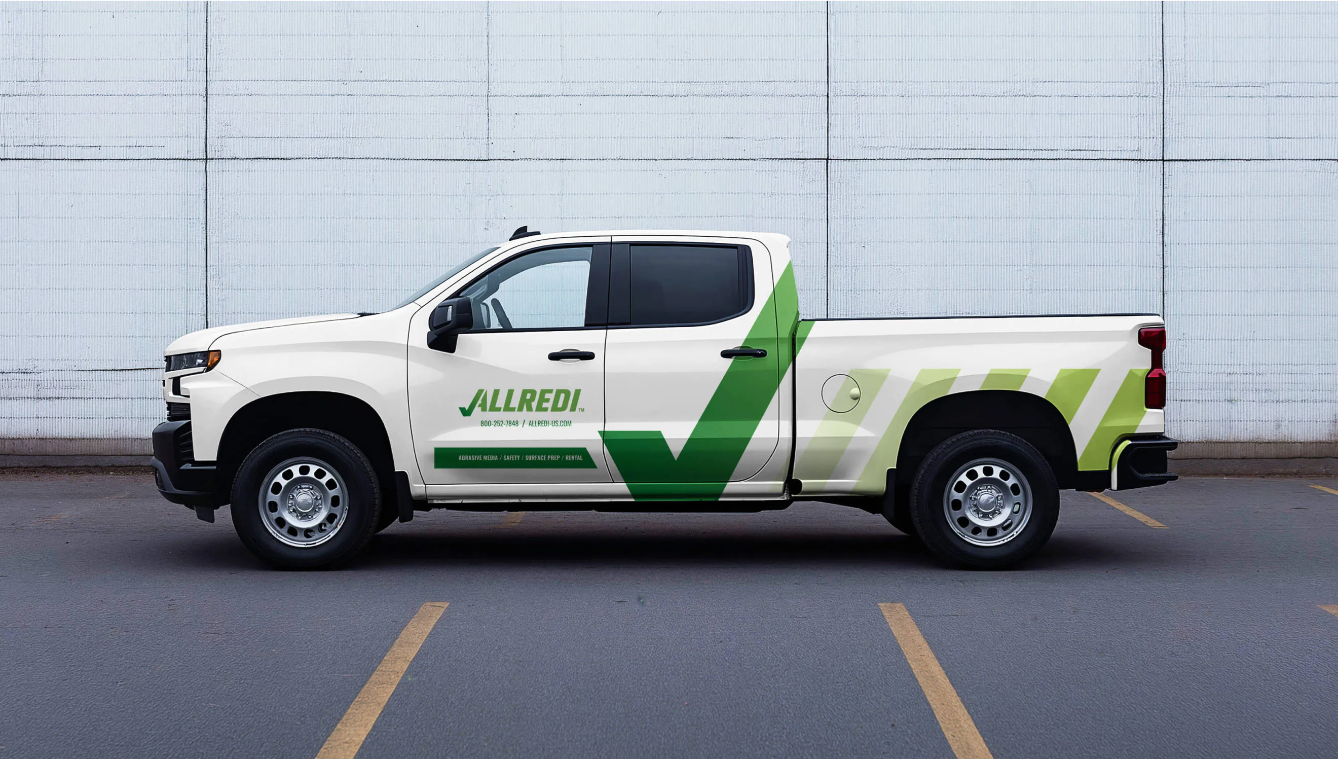 A truck with Allredi brand decals plastered on the side