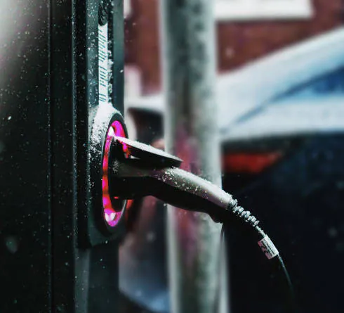 A Lynkwell electric charger getting wet in the rain