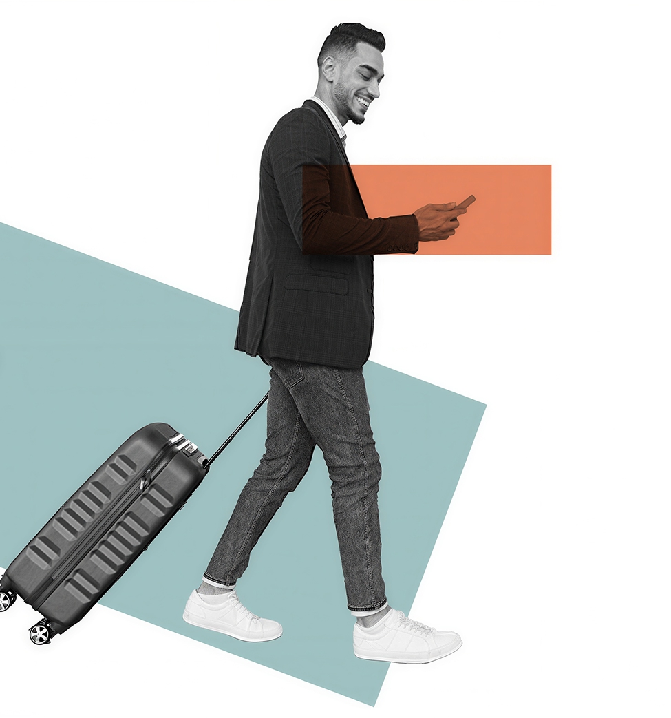 Business traveler walking while pulling a rolling suitcase and checking a smartphone, with teal and orange geometric accents.