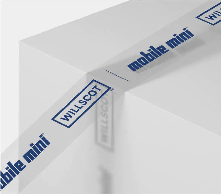WillScot branded tape pressing over the edge of a white box