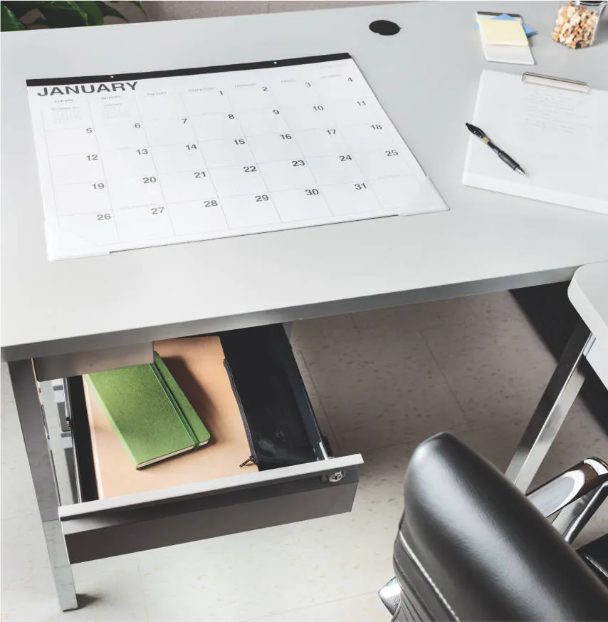 An image of a modular desk with a drawer open