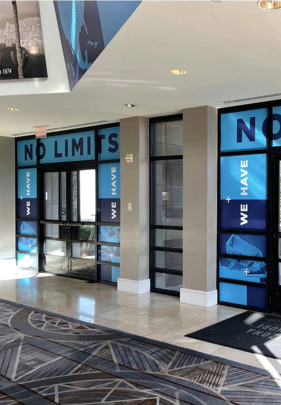 WillScot imagery plastered around glass doors inside their headquarters