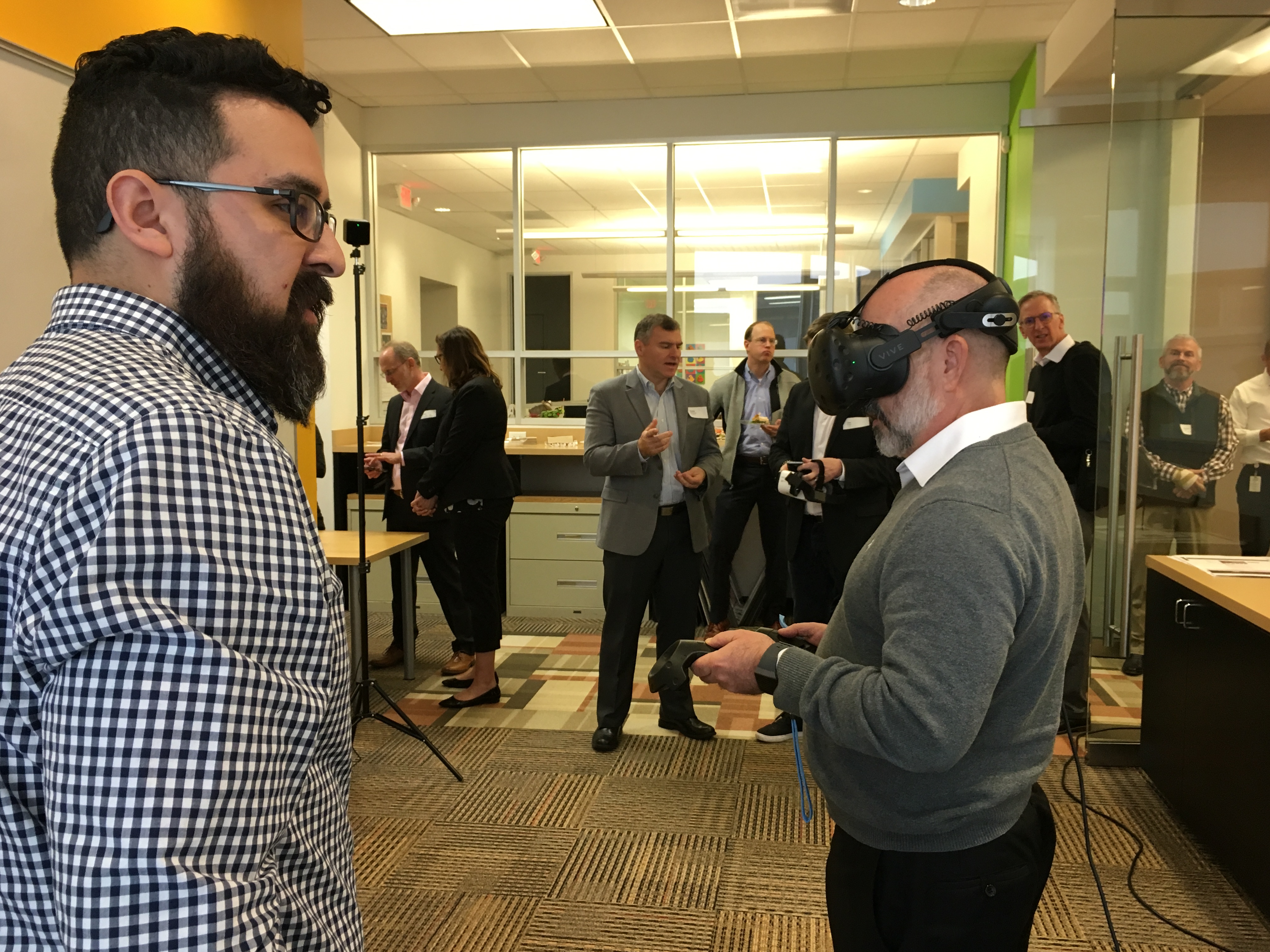 Clients utilizing VR/AR technology at BE's office.