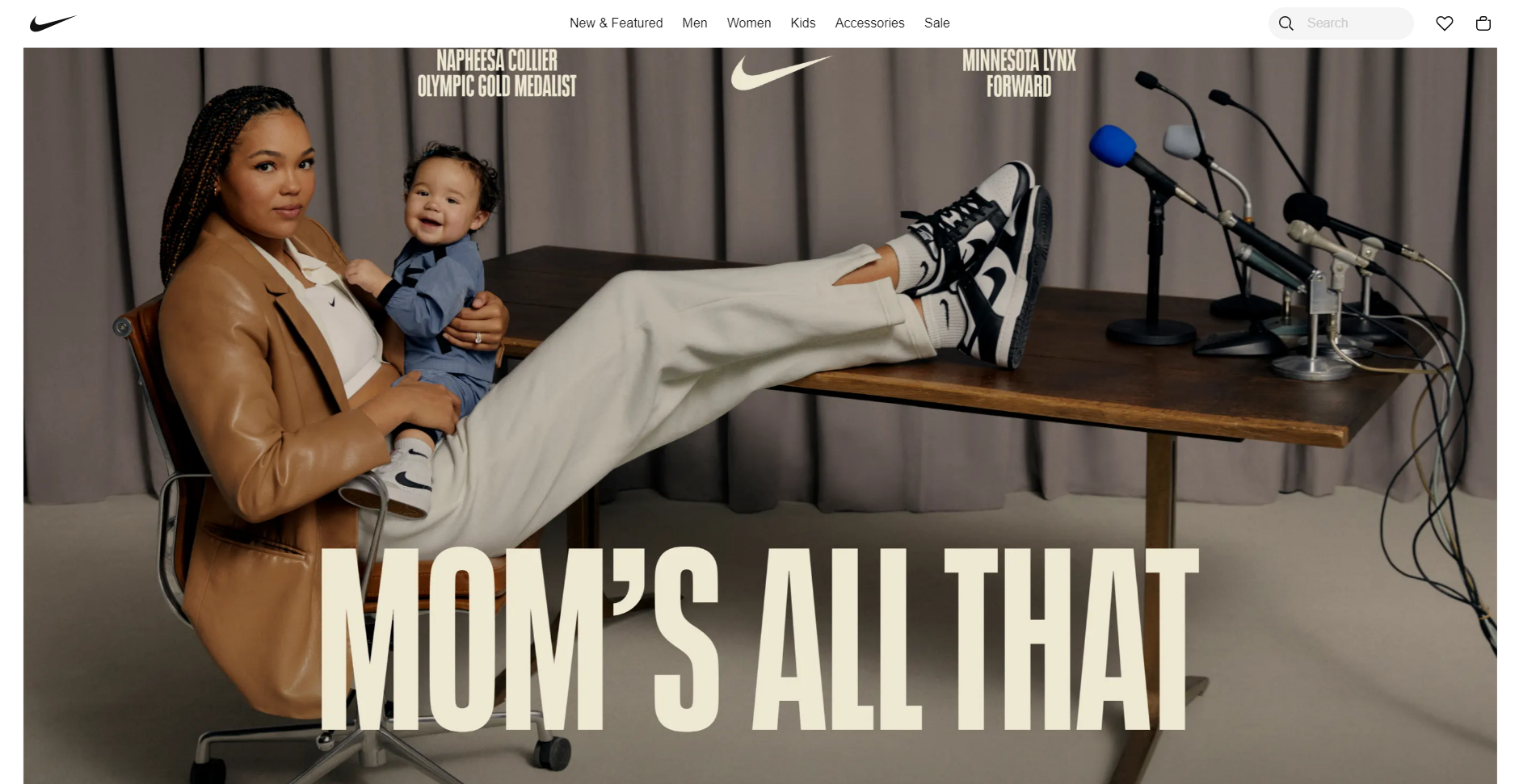 screenshot of the Nike homepage, which features a large header reading "Mom's all that" in Nike's iconic typeface