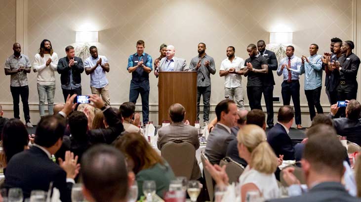 Panelists standing up at the Kareem Jackson Foundation 2017 Dinner for a Difference.