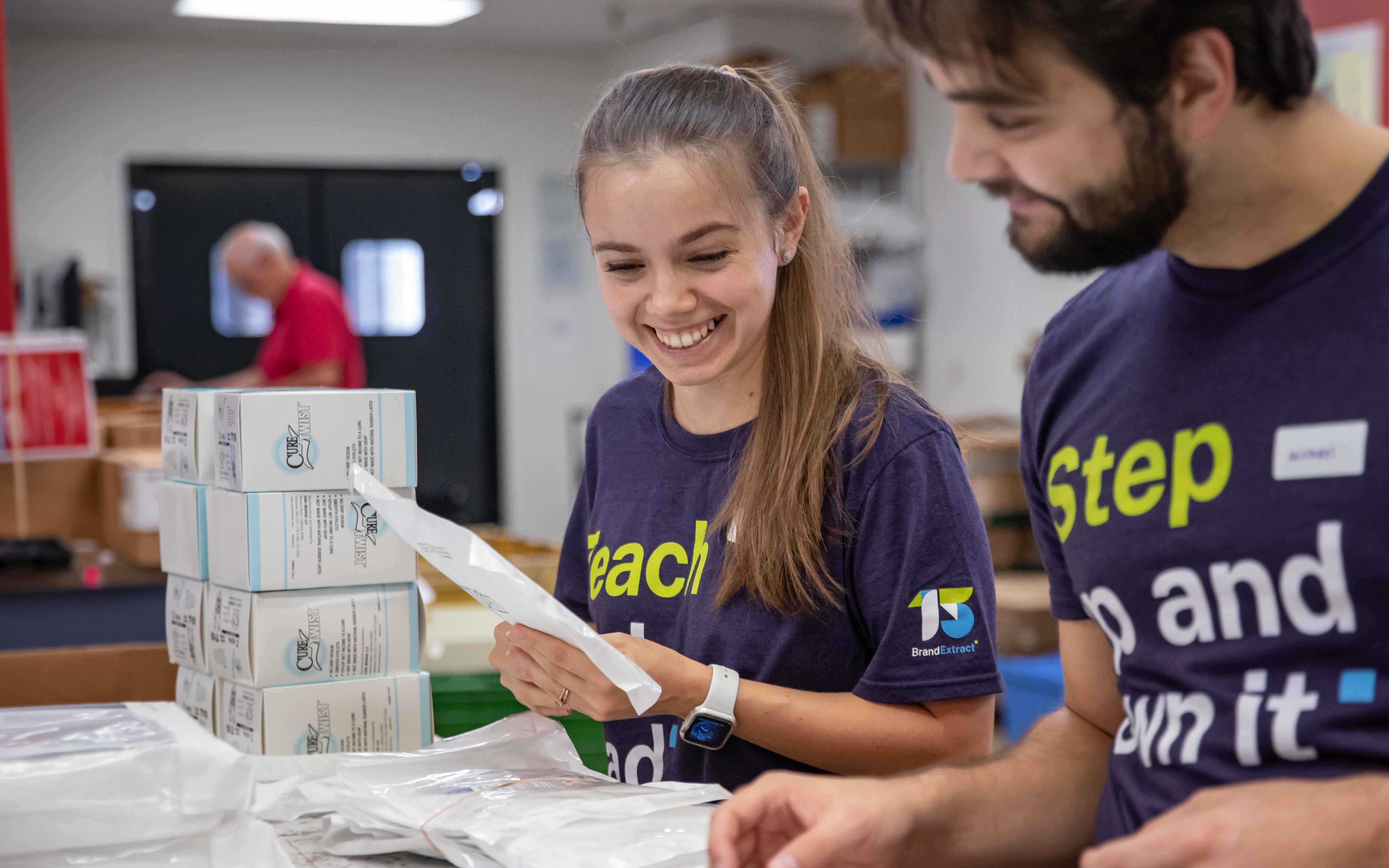 Yana and Michael sort medical supplies at Project C.U.R.E.