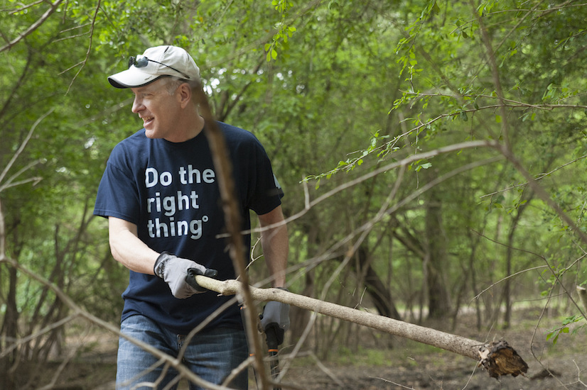 Scott lifting dead tree branches at Special CHEERS.