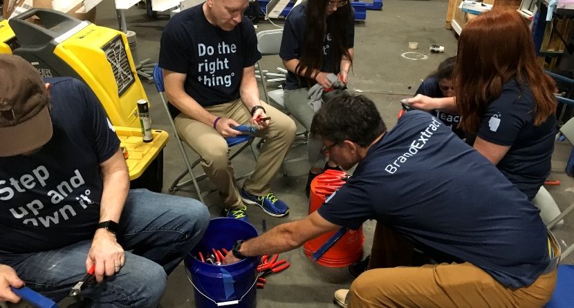 The BE team cleaning tools at the Houston ToolBank.