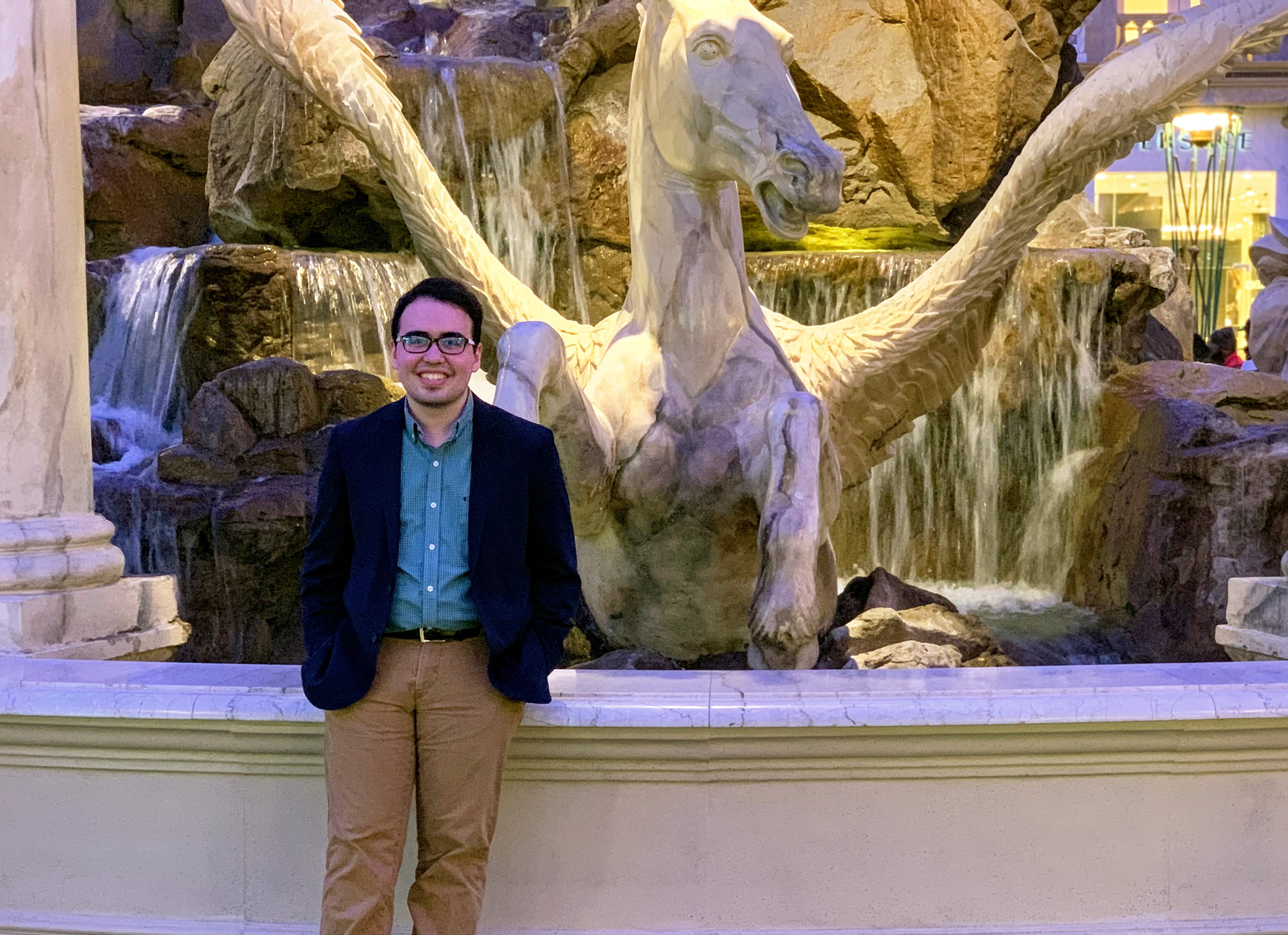 Ben standing in front of a fountain