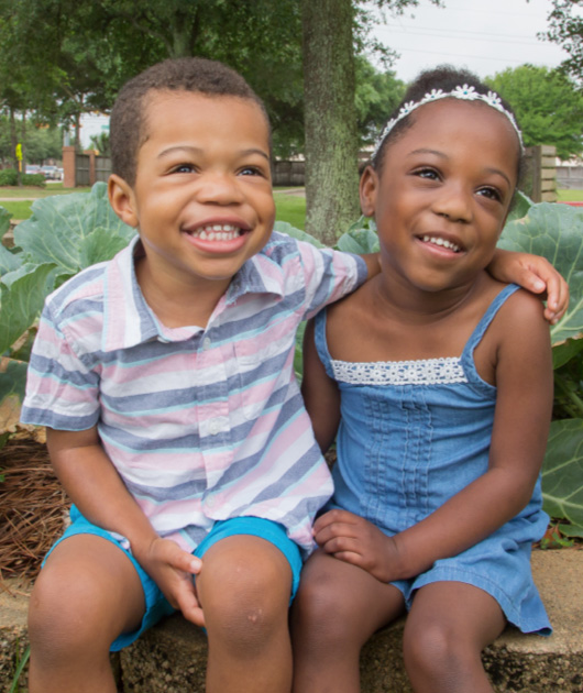 Two children embracing each other