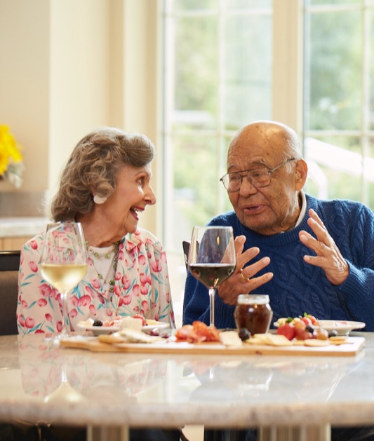 A couple of Belmont Village residents enjoying dinner 