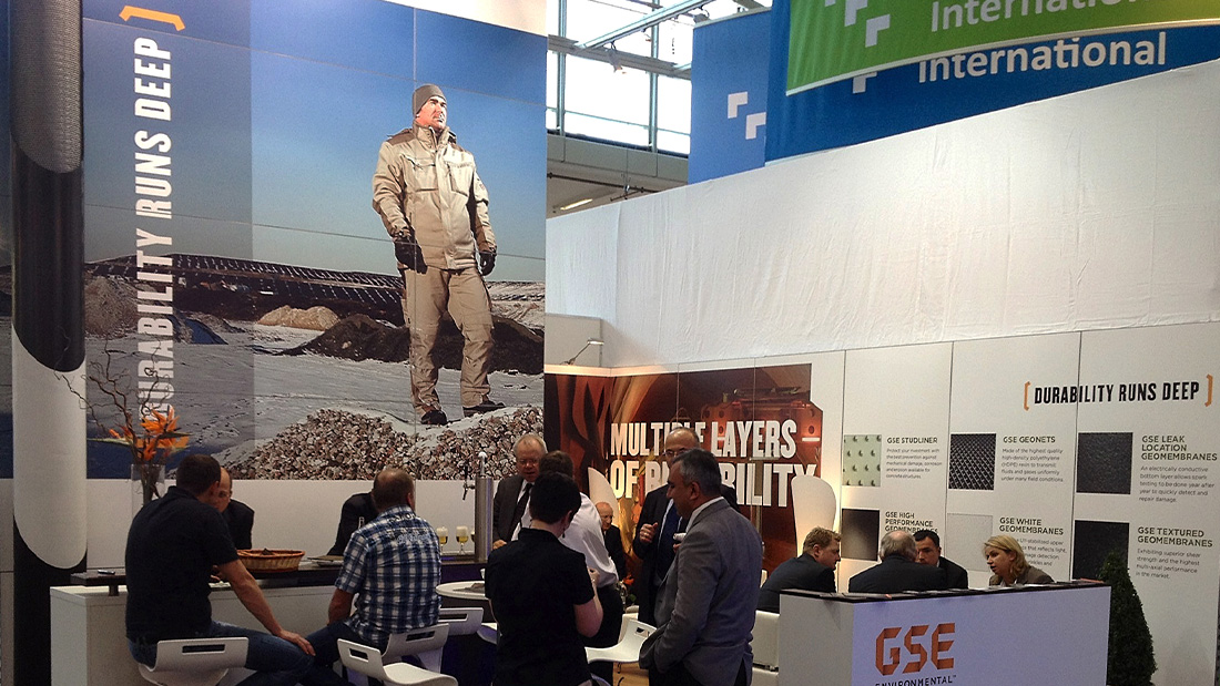 A GSE branded booth filled with people.