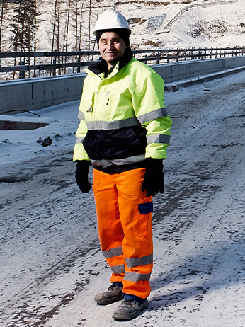 A GSE emloyee smiling at a railing.