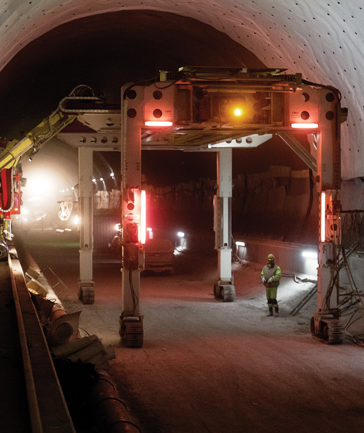 GSE workers operating machinery in a tunnel.
