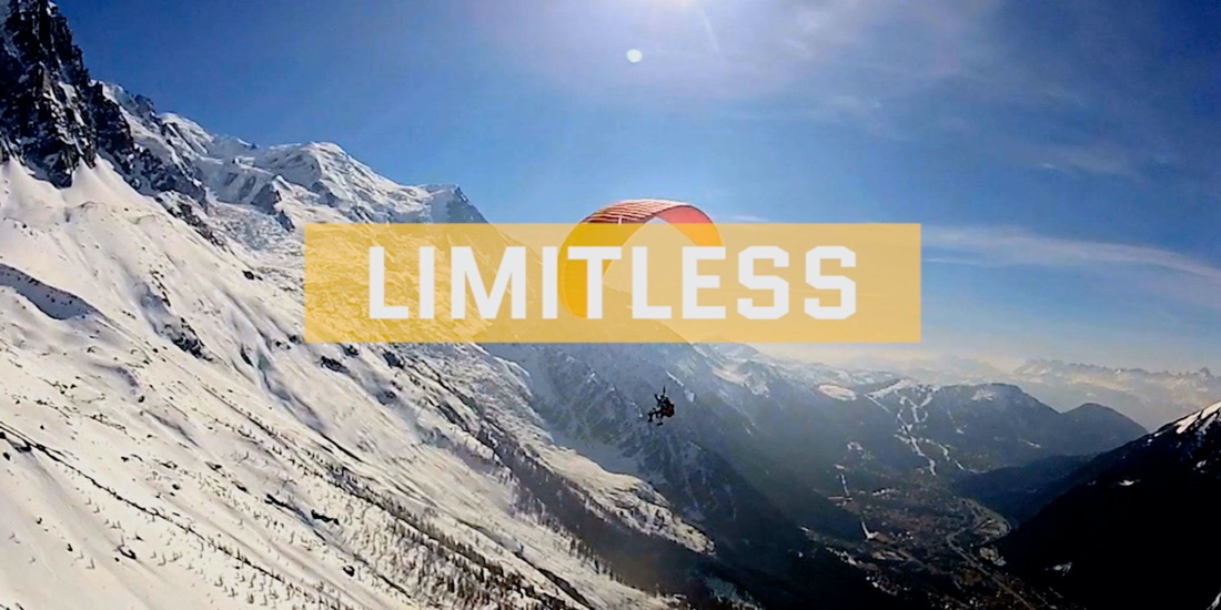 A person hanggliding with the caption 'limitless' overlayed. 